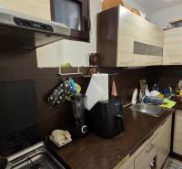 Kitchen in a family house with a kitchen unit, sink, and appliances.
