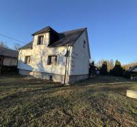 A family house in Demandice with two floors and a grass-covered plot.