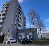 Office building on Račianska in Bratislava - Rača and parking lot in front of the building.