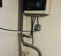 Electrical and plumbing installations in the cottage, including the cabinet and valves.