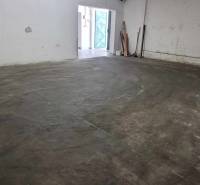 A view into the storage area on Železničná Street, with an entrance and a hall.