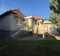 A family house in Machulince with a wooden roof and staircase on a built-up area.
