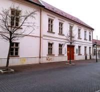 An office building on Františkánska Street in Trnava, in winter without leaves.