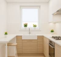 A kitchen in a 4-room apartment with white cabinets and a wood-patterned floor.
