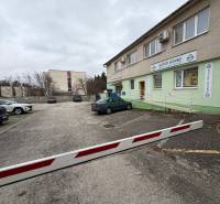 Commercial premises on Štefánikova in Senica with a parking lot in front of the building.
