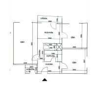Floor plan of a 3-room apartment with a loggia, kitchen, bathroom, toilet, and storage room.