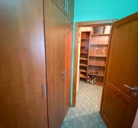 Storage space in a 3-room apartment with shelves and cabinets.