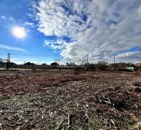 Sunny plot in Ondrejovce for living, with a beautiful sky and rural surroundings.