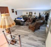 Living room with wooden decor and rustic furnishings in a family house.