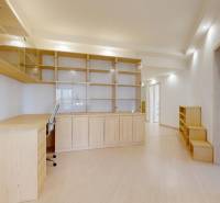 Interior design of a 5 or more room apartment with a wood-patterned floor and an office desk.