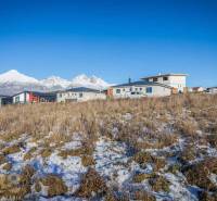 Residential plots in Mlynica with panoramic views and modern buildings in the background.
