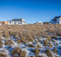 Plots - living in Mlynica with a view of snow-capped mountains and family houses.