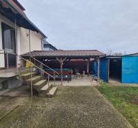 A family house in Hurbanovo with a spacious yard, a shelter, and external stairs.