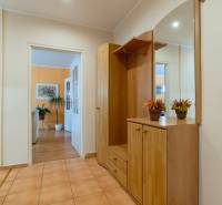 A hallway in a 4-room apartment with a built-in wardrobe and decorative elements.