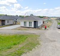 New family houses in Modrovka for residential plots, surrounded by green areas.