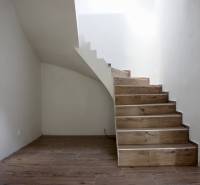 Staircase with wooden decor flooring in a family house.