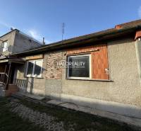A family house in Chynorany with an unfinished facade, covered with a classic tile roof.
