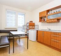 The kitchen in a 3-room apartment with a dining table, kitchen unit, and bright interior.