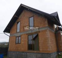 A family house under construction in Sady nad Torysou with a brick exterior and a pitched roof.
