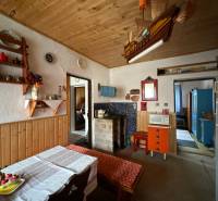Interior of a family house with a wooden ceiling and rustic furnishings.