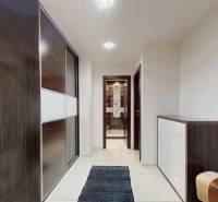 Hallway in a 3-room apartment with a built-in wardrobe and tiles.