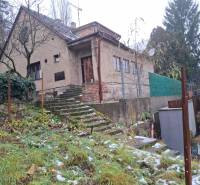 A family house on Búdková Street in Bratislava - Staré Mesto with a snow-covered garden.