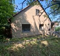 A family house on Búdková in Bratislava - Staré Mesto surrounded by greenery and a grassy plot.