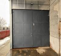 Industrial entrance gate and walls in the offices of Poprad, snowy exteriors.