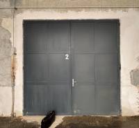 Closed metal door with the number 2 in the Offices in Poprad.