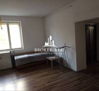 A family house with a wooden decor floor, window, and furniture.