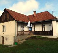 A family house in Rudabánya with a grassy garden and a gable roof.