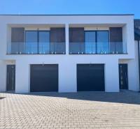 A family house on Polnokesovska Street in Mojmírovce with a glass balcony and a double garage.