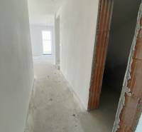 Hallway in a family house, plastered walls, basic electrical installation prepared.