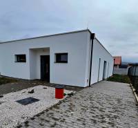 A family house in Moravany nad Váhom on Dolinky Street with a simple white exterior.