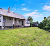 A family house in Nováky with a garden, lawn, and clothesline.