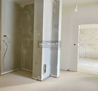 An unfinished renovation of a family house with exposed walls and an opening for a staircase.