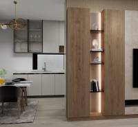 Dining area with kitchen in a family house with a wooden decor floor.