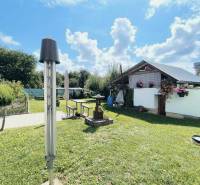 A garden in Partizánske with a gazebo and floral decorations by the family house.