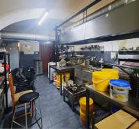 Kitchen spaces with equipment and utensils ready for use in a catering area.