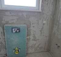 Bathroom construction site in a family house with a modern installation frame for the toilet.