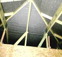 A family house with a wooden roof structure and OSB boards in the attic.