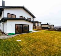 A family house in Stará Ľubovňa with a large garden and a bright facade.