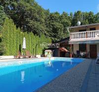 Cottage in Byšta with a pool, terrace, trees, and garden furniture for relaxation.