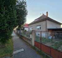 A family house on Slnečná Street in Nové Mesto nad Váhom, with a fence and a sidewalk.