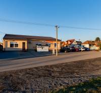Borovicová Street in Lozorno shows residential plots with a building and parking.