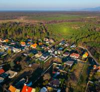A view of the residential area in Lozorno on Borovicová Street surrounded by green landscape. Plots - housing.