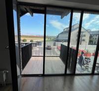 Glazed balcony with a view of the streets of Bratislava - Jarovce, Námestie pri Sýpke, 2-room apartment.