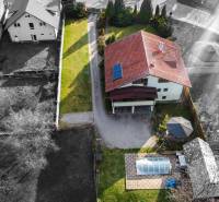 Aerial view of a villa on Andreja Sládkoviča Street in Žarnovica with a yard and a swimming pool.