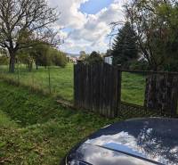 Plots - housing on Malá Domaša Street in Vranov nad Topľou, fenced green area with trees.