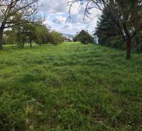 Residential plots in the town of Vranov nad Topľou on Malá Domaša Street with grassy areas.